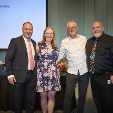 Group photo of Superintendent, Board Chair, Retiree and Administrator